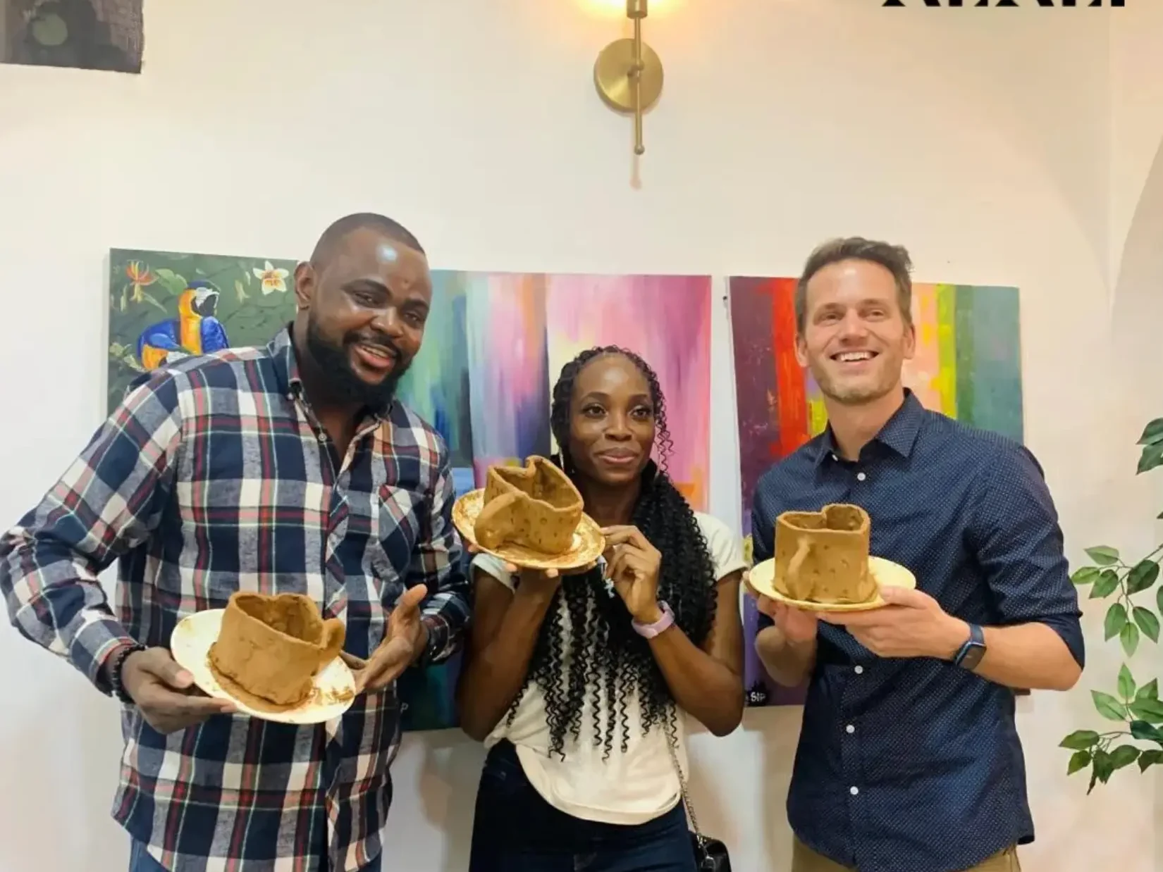Families making pottery together at Alali, Victoria Island